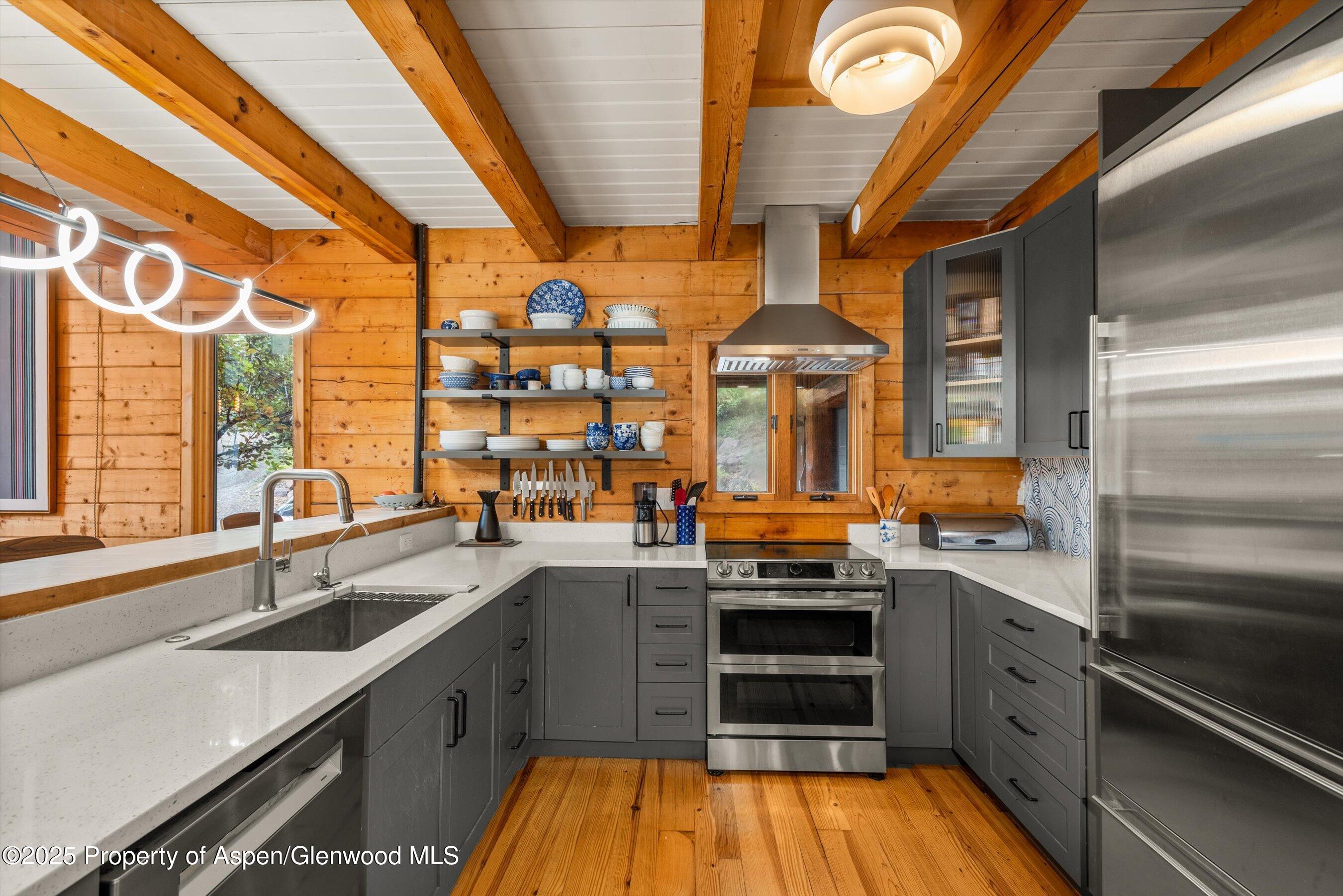 166 Ute Trail Carbondale, CO 81623 - Photo 23 of 38 a kitchen with lots of counter top space and appliances