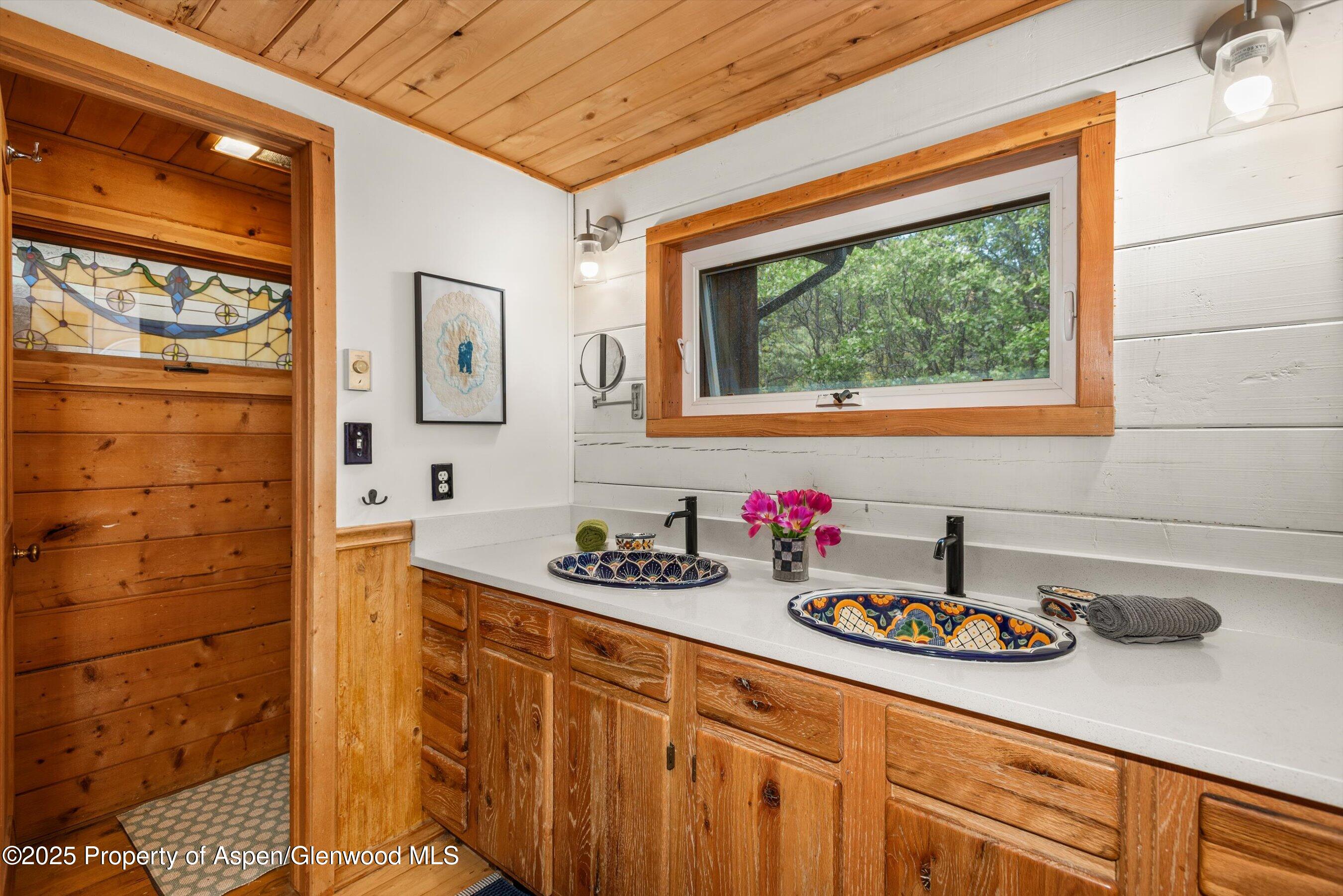 166 Ute Trail Carbondale, CO 81623 - Photo 28 of 38 a bathroom with a sink and a mirror