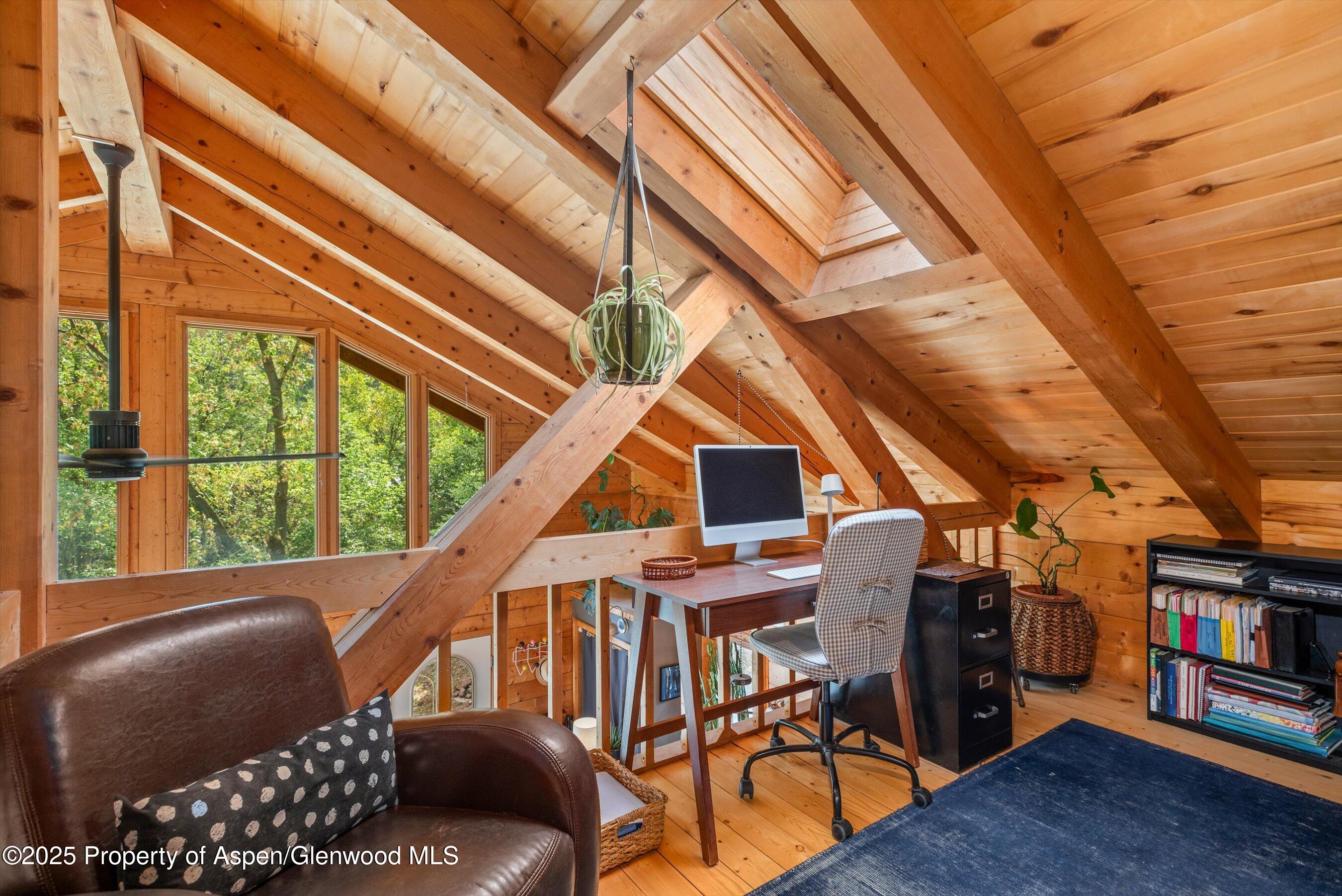 166 Ute Trail Carbondale, CO 81623 - Photo 33 of 38 a balcony with furniture and wooden floor