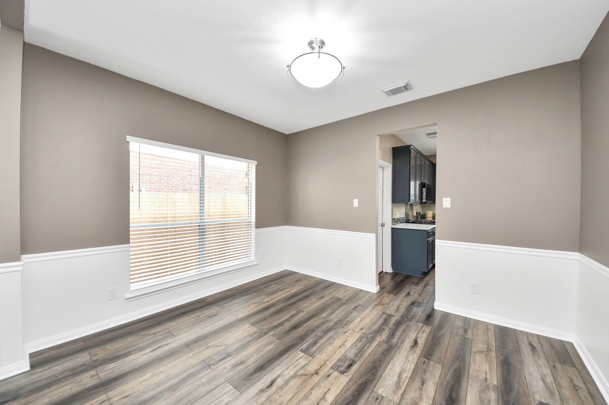 7622 McCormick Mill Court Houston, TX 77095 - Photo 12 of 37 a view of empty room with wooden floor and fan