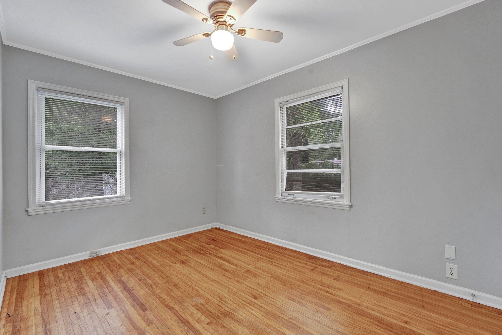985 Wellsville Road Memphis, TN 38117 - Photo 11 of 24 a view of an empty room with wooden floor and a window