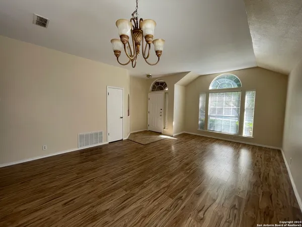 a view of an entryway with wooden floor