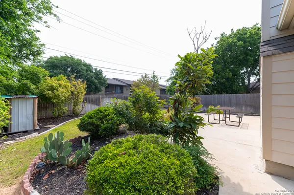 a front view of a house with a yard and outdoor seating