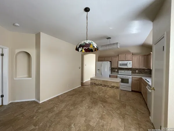 a view of a kitchen with microwave and stove