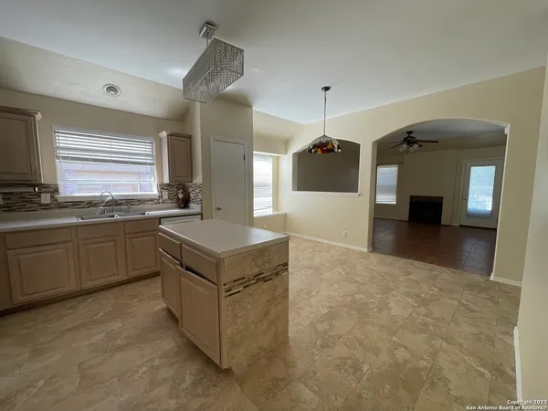 a kitchen with a stove and a sink
