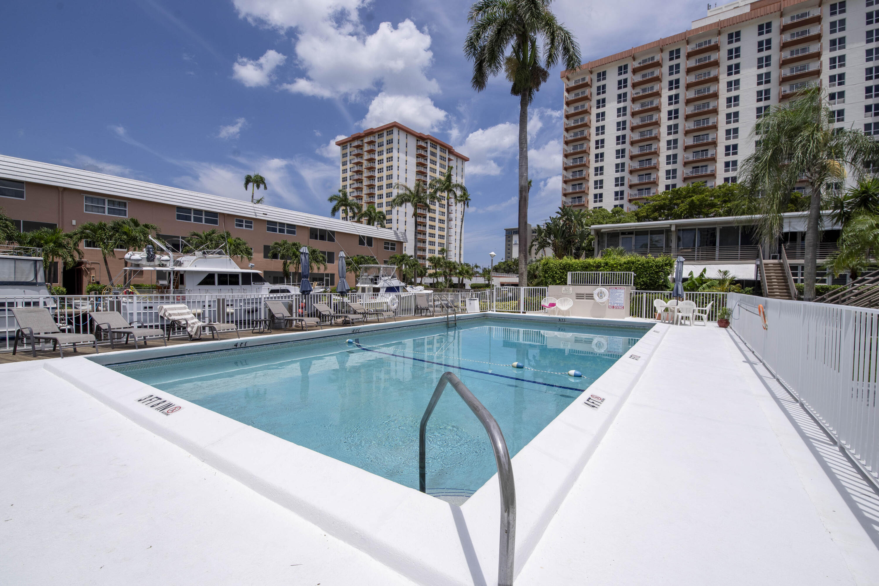 901 North Birch Road, Unit D10 Fort Lauderdale, FL 33304 - Photo 10 of 20 a view of a swimming pool with outdoor seating