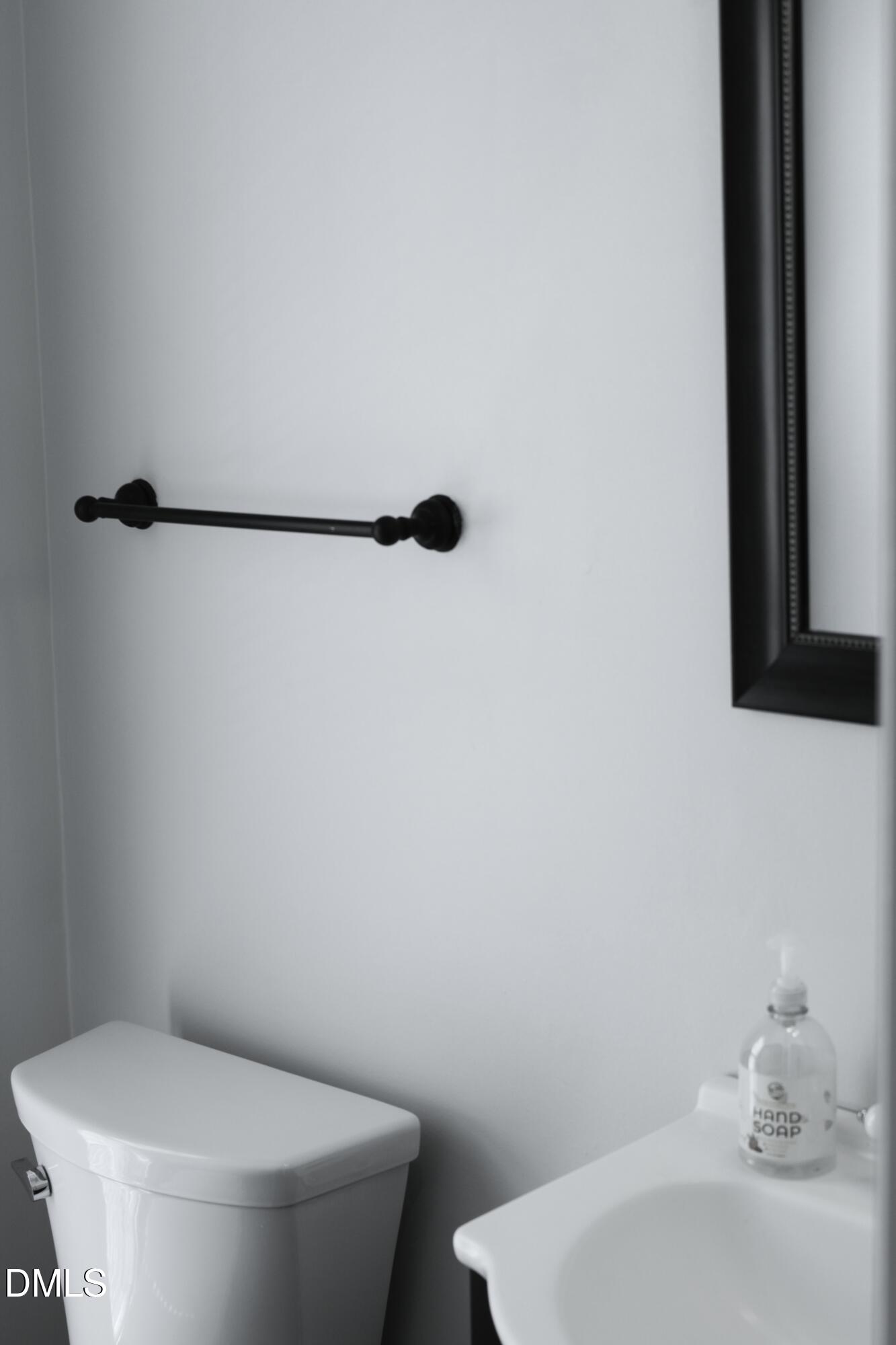 3109 Benton Circle Raleigh, NC 27615 - Photo 9 of 29 a white toilet sitting next to a bathroom sink