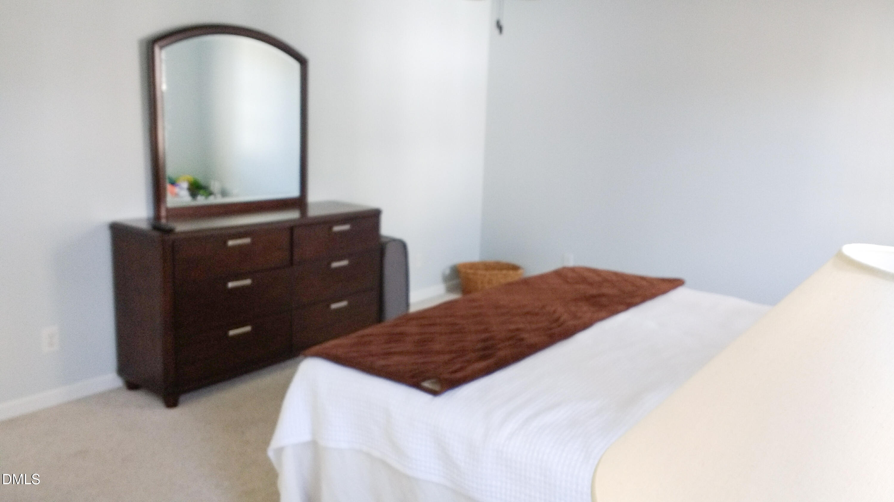 3109 Benton Circle Raleigh, NC 27615 - Photo 16 of 29 a bedroom with a bed and a dresser