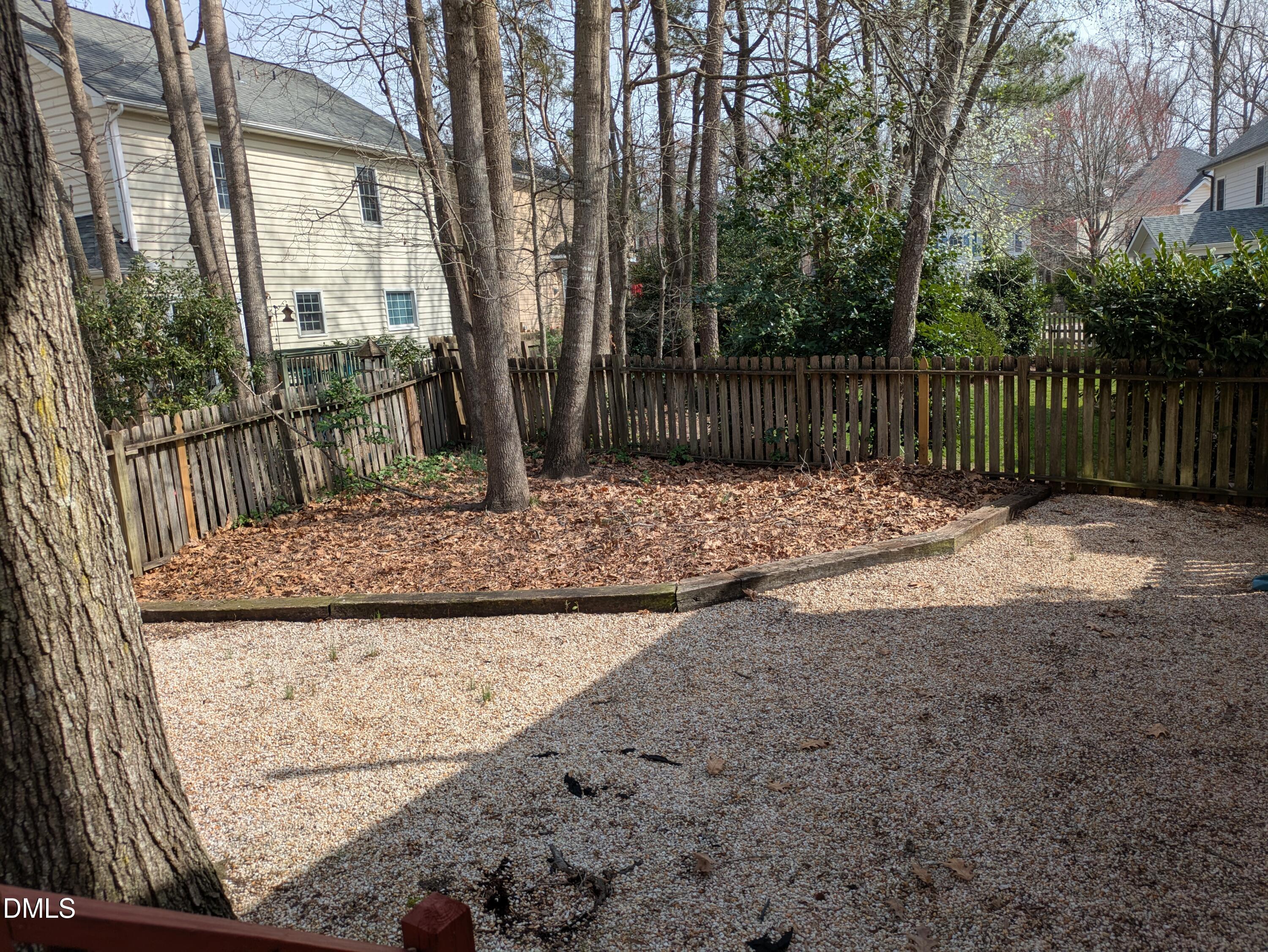 3109 Benton Circle Raleigh, NC 27615 - Photo 21 of 29 a backyard of a house with lots of green space