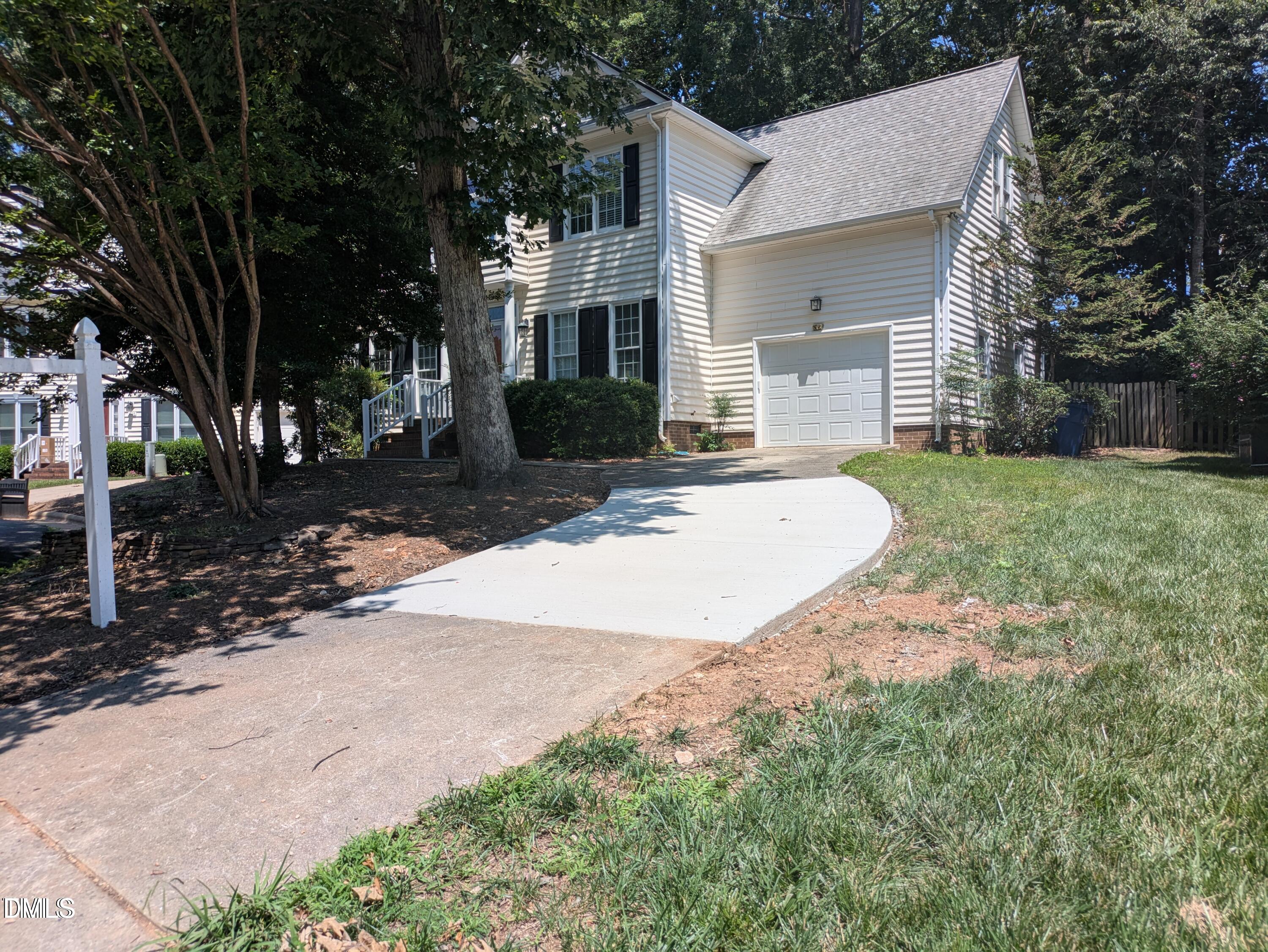 3109 Benton Circle Raleigh, NC 27615 - Photo 2 of 29 a view of a house with backyard and trees