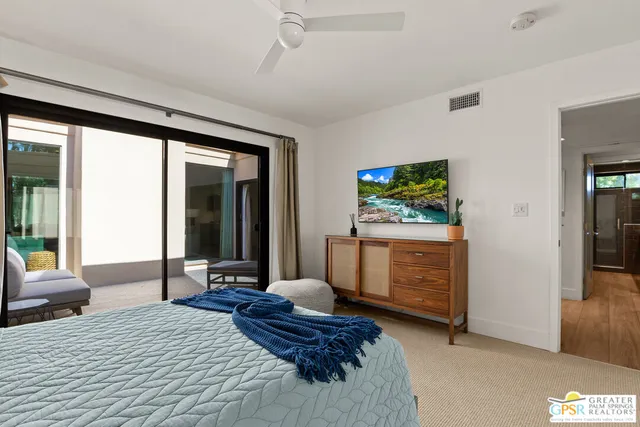 a bedroom with furniture and a window