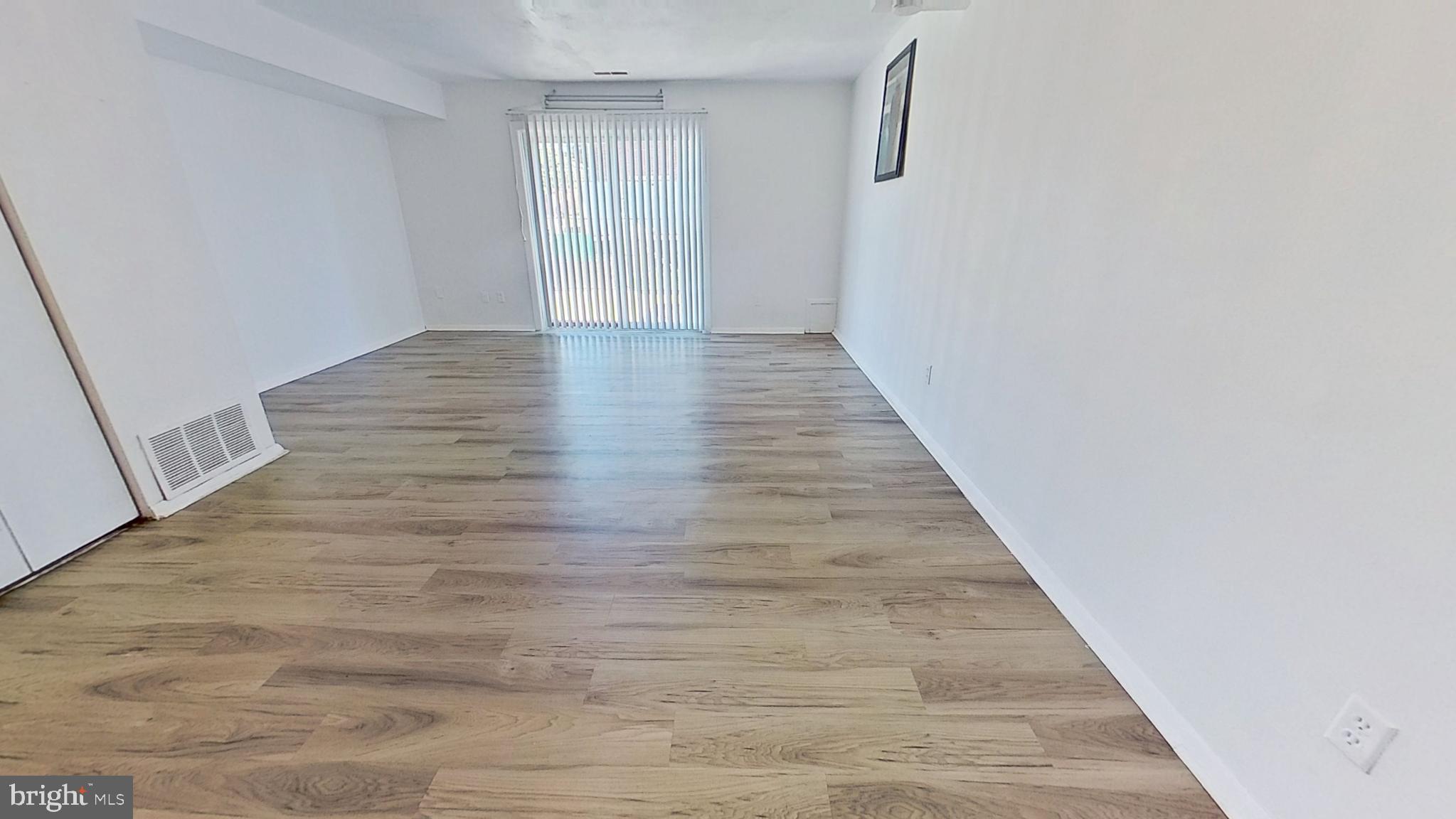 711 Hardwick Place York, PA 17404 - Photo 4 of 10 a view of a hallway with wooden floor