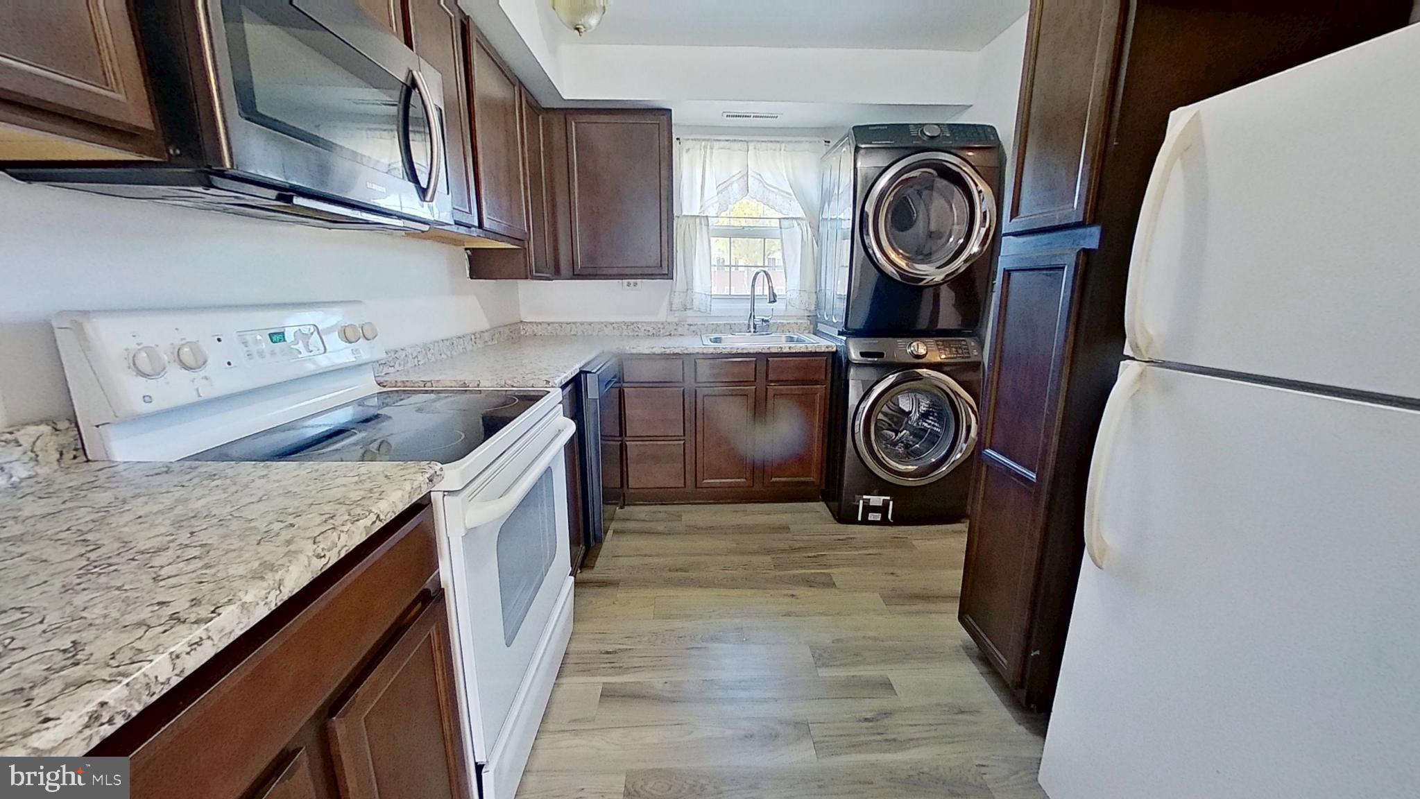 711 Hardwick Place York, PA 17404 - Photo 5 of 10 a view of cabinets with wooden floor washer and dryer