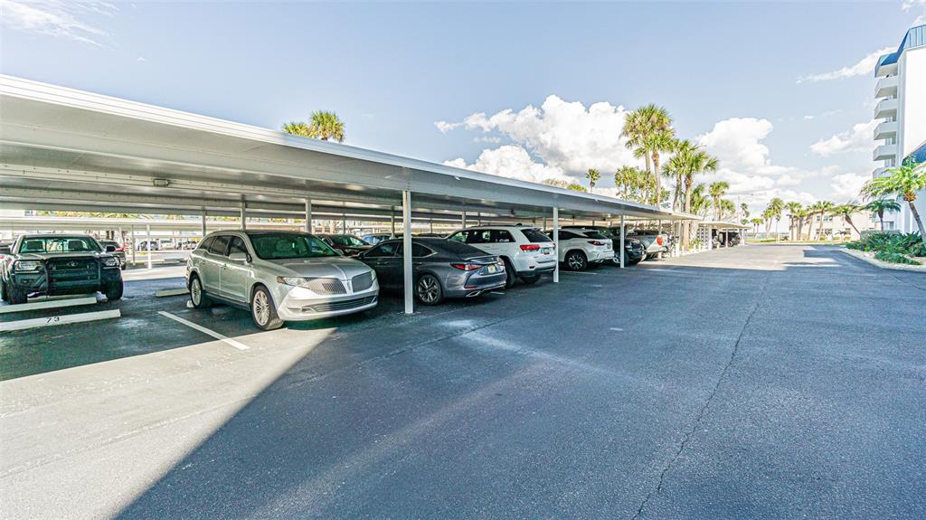 7 Elgin Place, Unit 301 Dunedin, FL 34698 - Photo 23 of 35 a view of a cars parking space