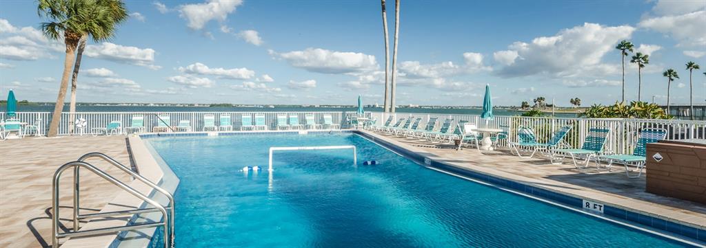 7 Elgin Place, Unit 301 Dunedin, FL 34698 - Photo 24 of 35 a view of swimming pool from a balcony