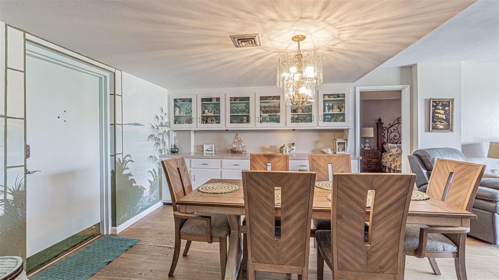 7 Elgin Place, Unit 301 Dunedin, FL 34698 - Photo 5 of 35 a view of a dining room with furniture window and outside view