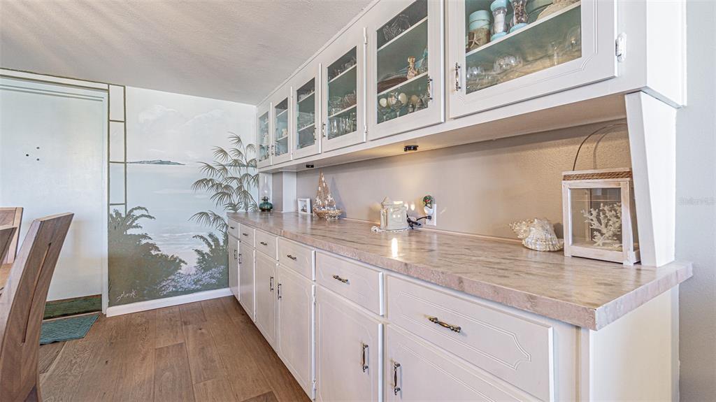 7 Elgin Place, Unit 301 Dunedin, FL 34698 - Photo 6 of 35 a kitchen with stainless steel appliances granite countertop a sink and cabinets