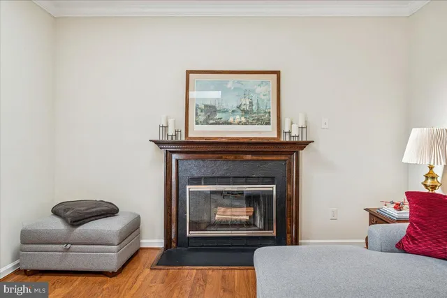 a living room with furniture a flat screen tv and a window