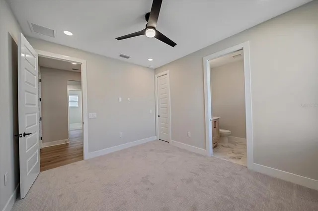 a large kitchen with stainless steel appliances