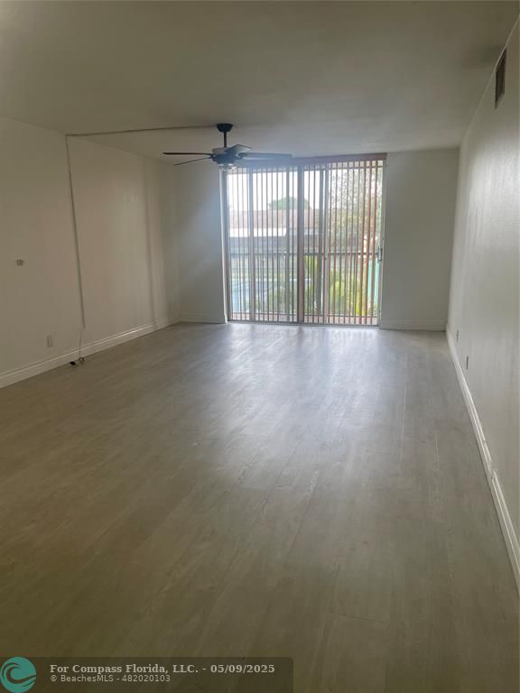 7175 Orange Drive, Unit 216H Davie, FL 33314 - Photo 11 of 14 an empty room with windows