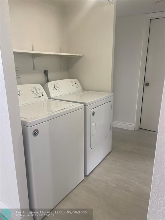 7175 Orange Drive, Unit 216H Davie, FL 33314 - Photo 12 of 14 a utility room with dryer and washer