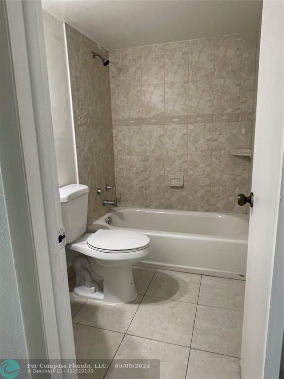 7175 Orange Drive, Unit 216H Davie, FL 33314 - Photo 6 of 14 a bathroom with a toilet a sink and a shower