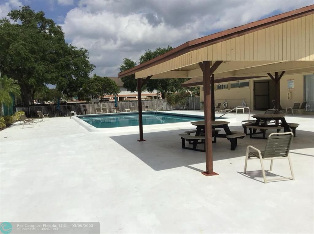 7175 Orange Drive, Unit 216H Davie, FL 33314 - Photo 8 of 14 a view of outdoor space with seating