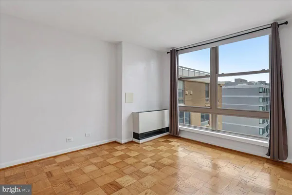 a view of an empty room with a window