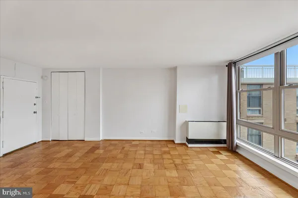 a view of an empty room with a window