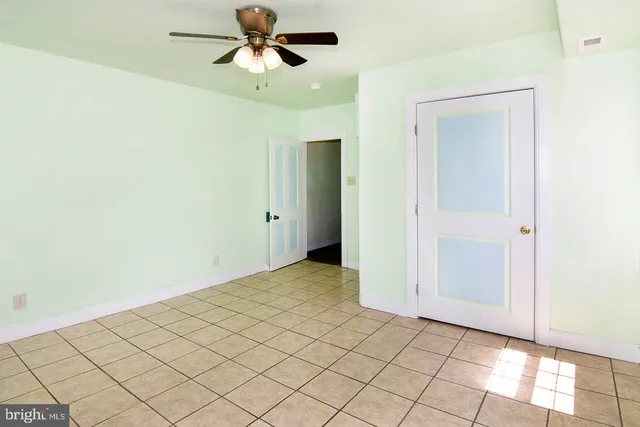 a kitchen with stainless steel appliances granite countertop a refrigerator and a stove