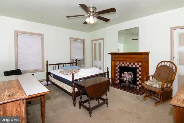 a bedroom with bed and a chandelier