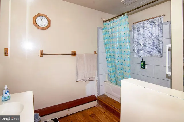 a front view of house with yard and trees