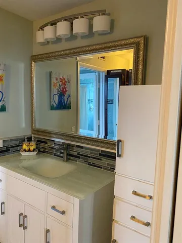 a bathroom with a toilet and a sink