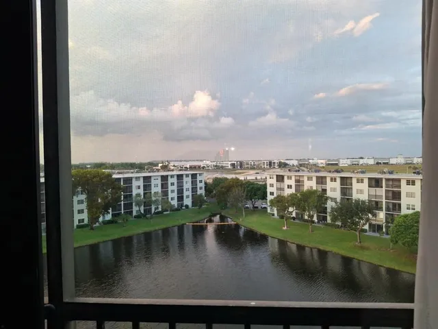 a city street lined with buildings and cars
