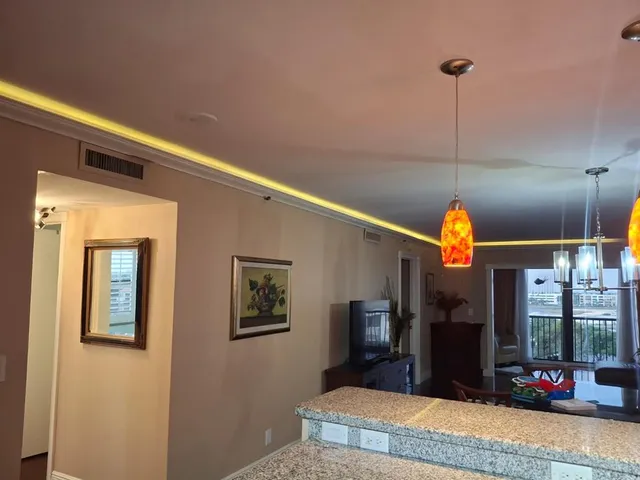 a view of a dining room with furniture window and outside view