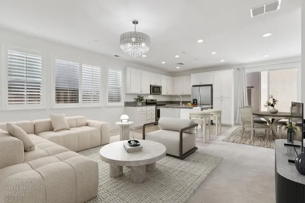 a kitchen with stainless steel appliances granite countertop a refrigerator a stove a sink and a refrigerator