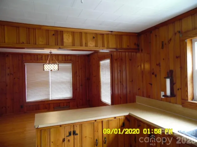 a view of front door with wooden door
