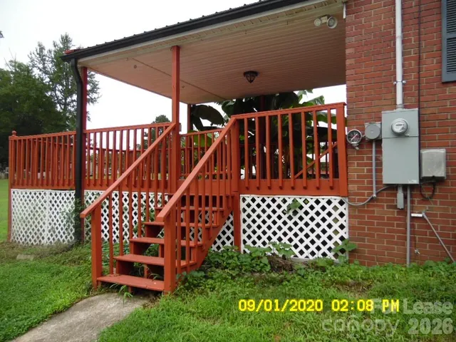 a view of outdoor space with deck and garden