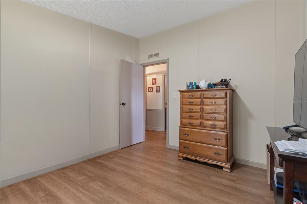 26255 Lambeth Road Brooksville, FL 34601 - Photo 36 of 76 a view of room with furniture and wooden floor