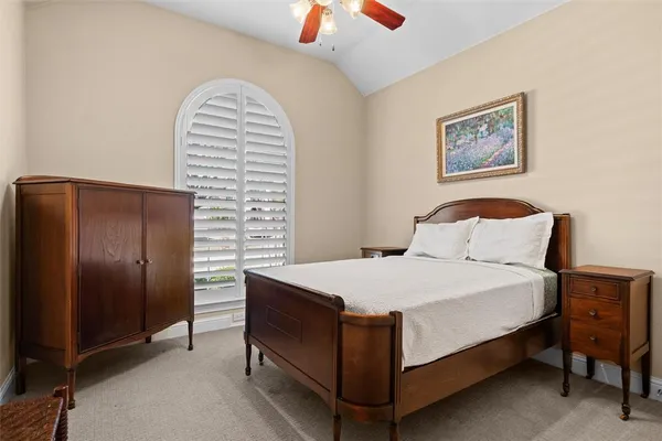 a white bath tub sitting next to a shower