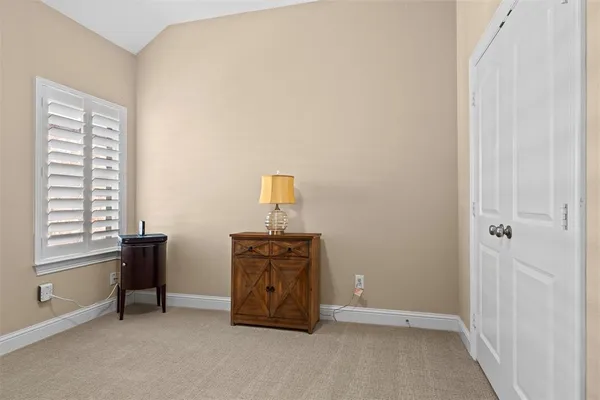 a bathroom with a granite countertop sink toilet and a mirror