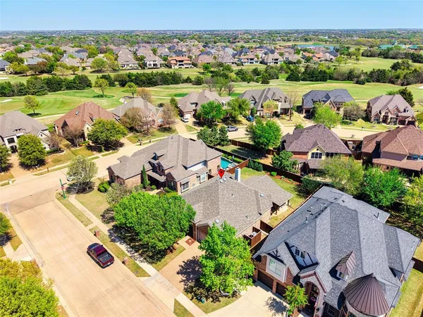 an aerial view of a house with a lake view