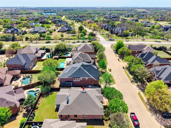 an aerial view of a house with yard