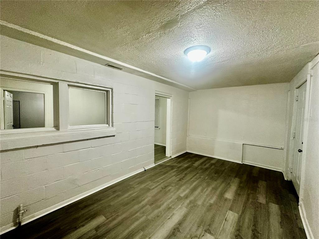 1907 Rio Grande Avenue Orlando, FL 32805 - Photo 4 of 17 wooden floor in an empty room