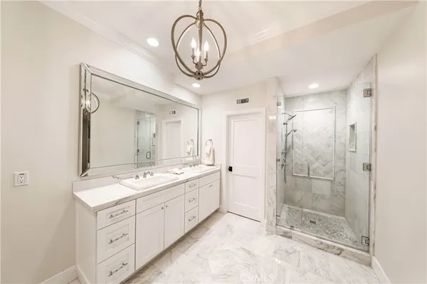 a bathroom with a glass shower door