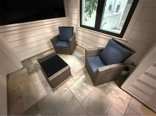 a view of a hallway with wooden floor and closet