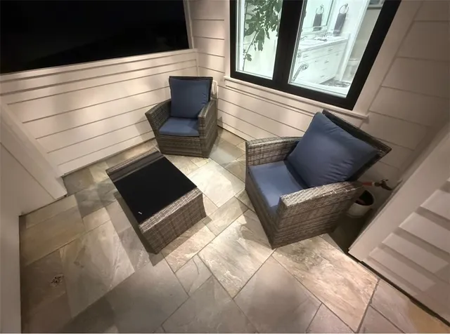 a bathroom with a granite countertop sink toilet mirror and shower