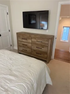 an aerial view of a house with a yard swimming pool and outdoor seating