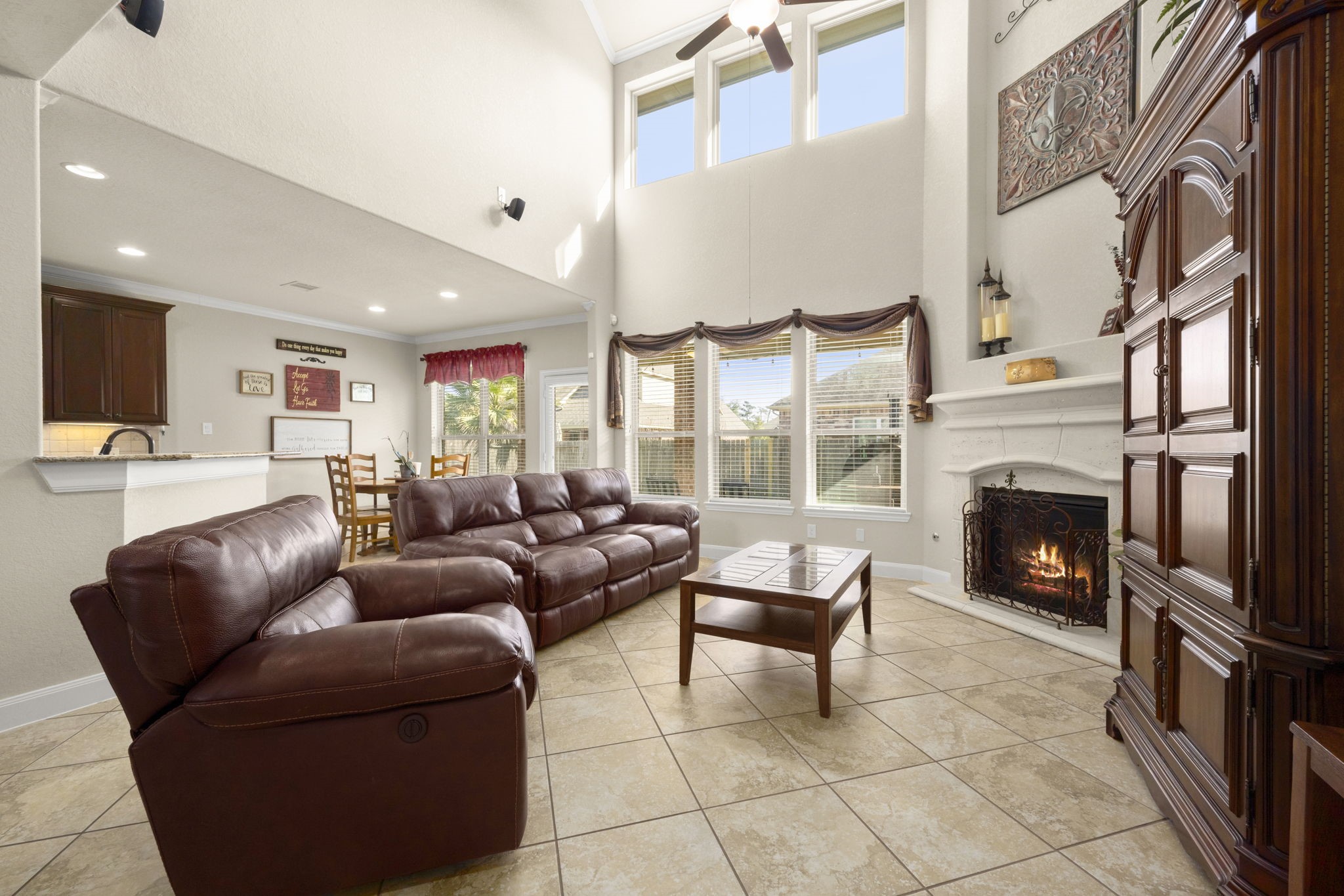 25306 Doyle Sands Court Spring, TX 77389 - Photo 13 of 35 Living area connecting seamlessly to the kitchen and dining spaces—great for entertaining. Surround sound system conveys with the home.