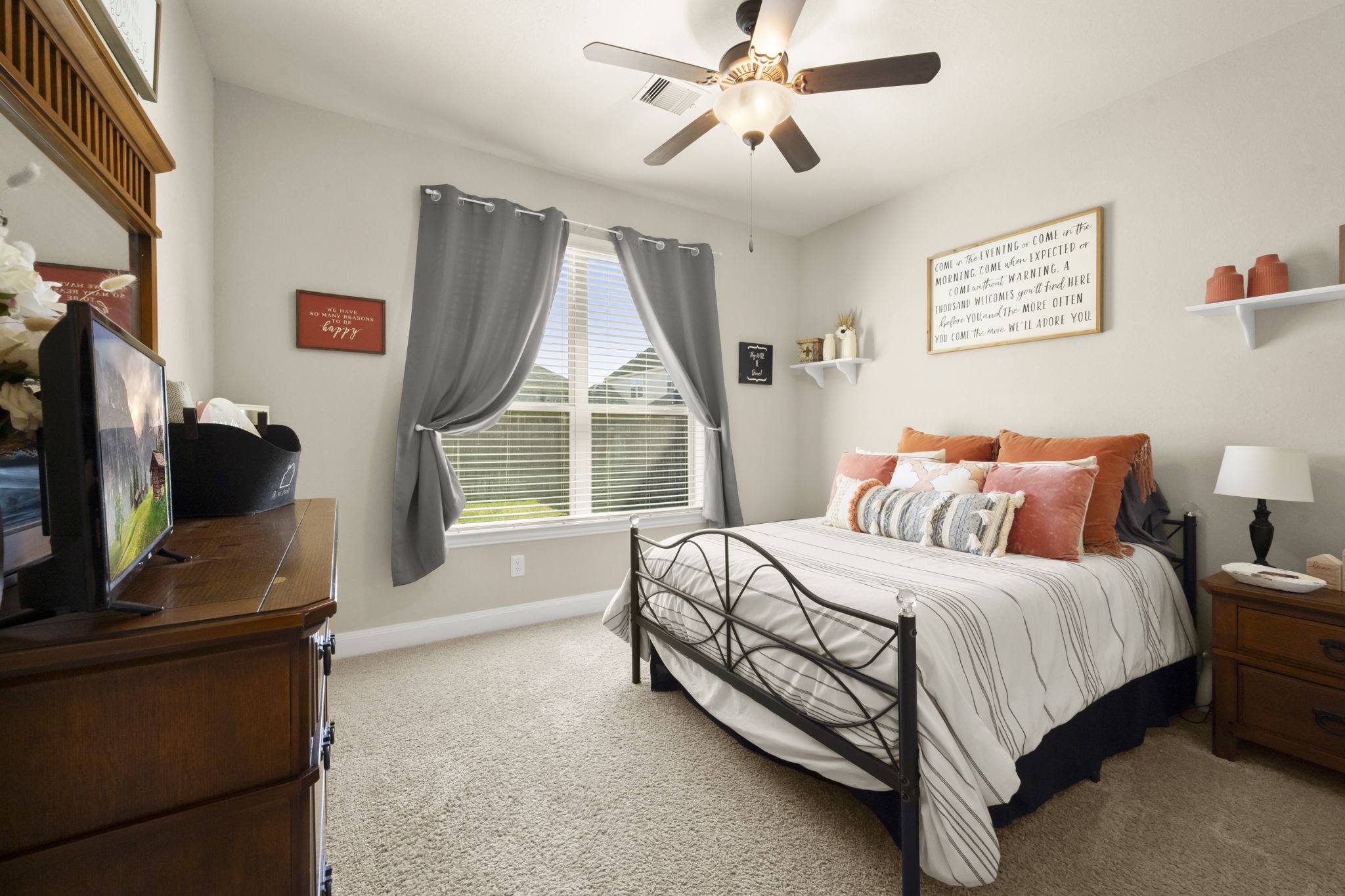 25306 Doyle Sands Court Spring, TX 77389 - Photo 23 of 35 Cozy first-floor bedroom with soft carpeting, neutral tones, and a large window for natural light.